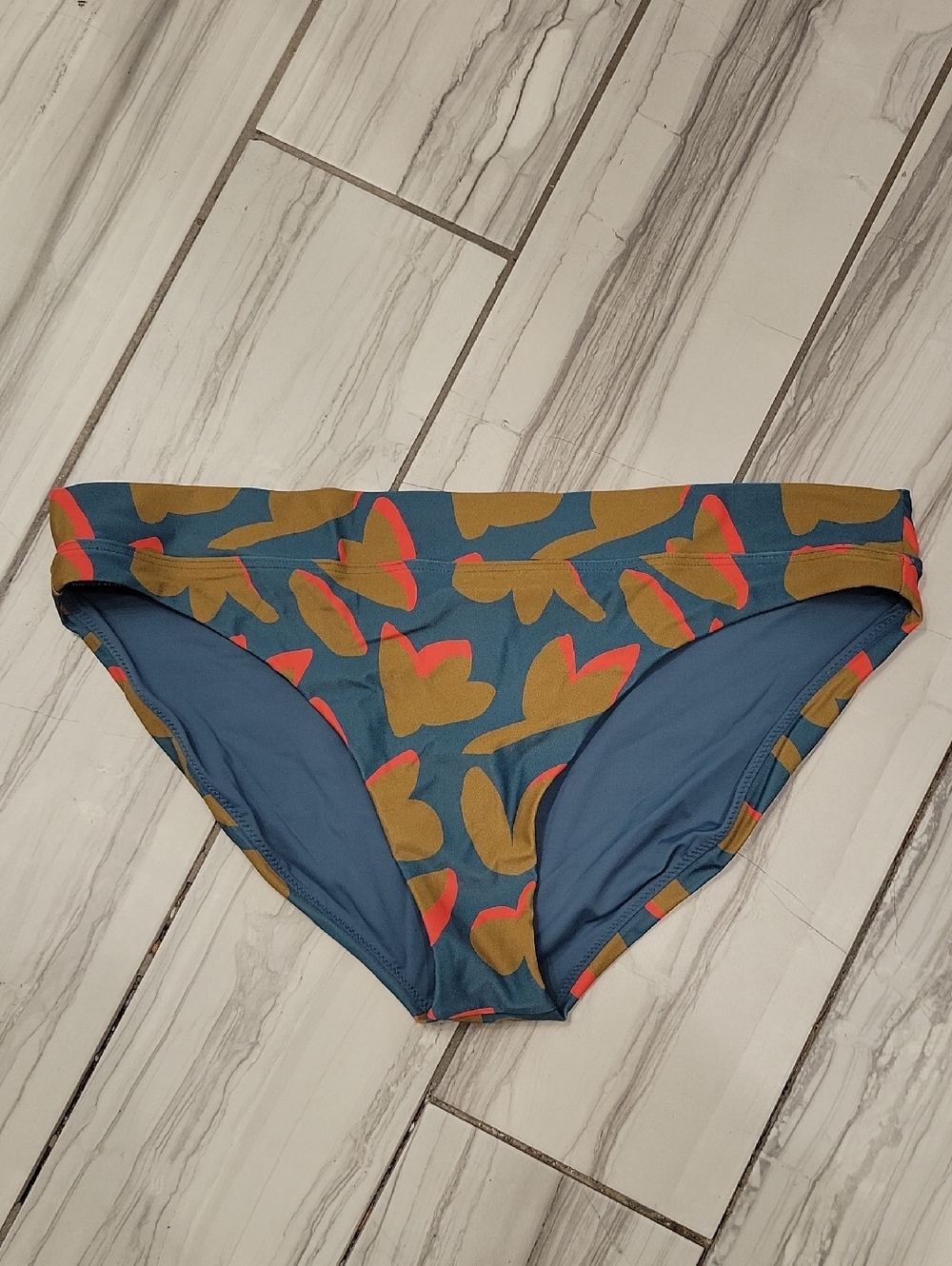 Prana Blue Swim Top with Coral and Mustard Accents. NWOT